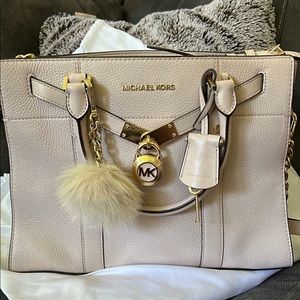 Mauve Michael Kors purse with gold chain, lock & key